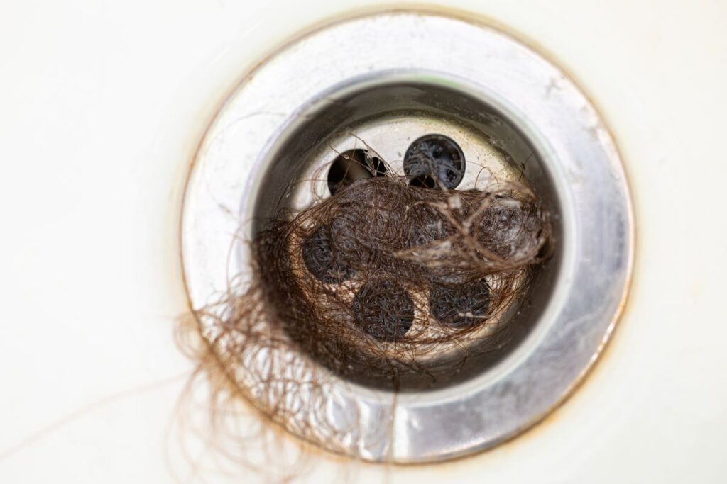 Slow draining tub hair in drain
